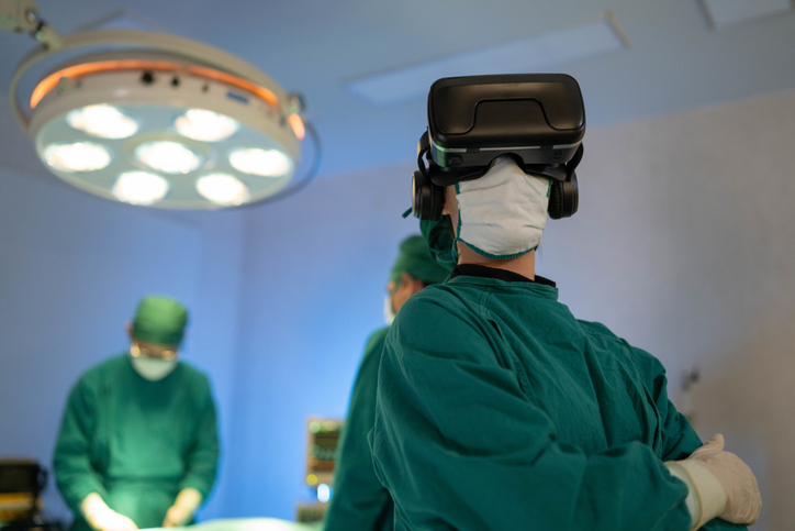 doctor in operating room wearing vr